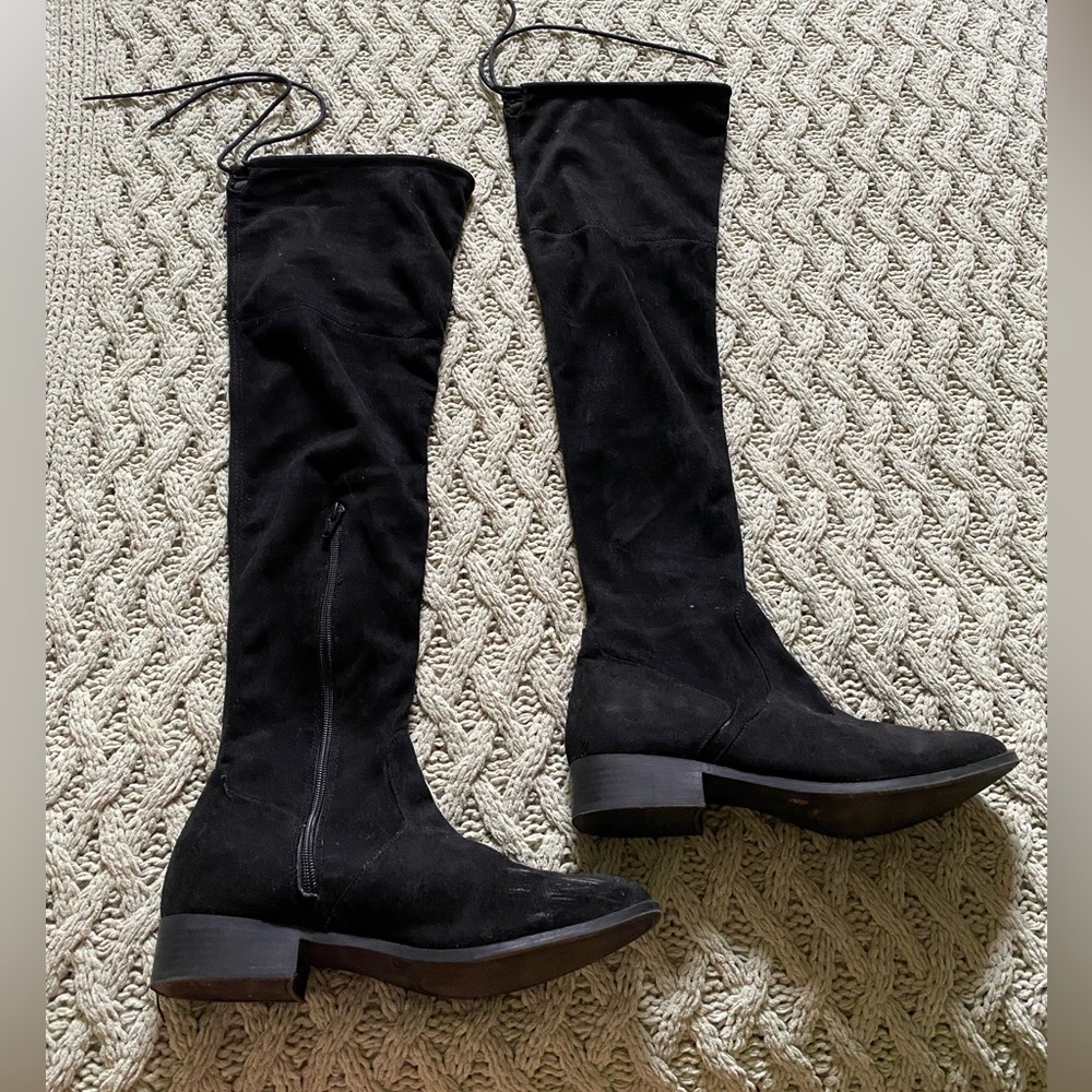 Black knee high boots. Light scuffing on toe of left boot
